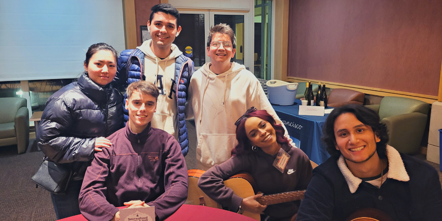 International students and friends attending a reception. 