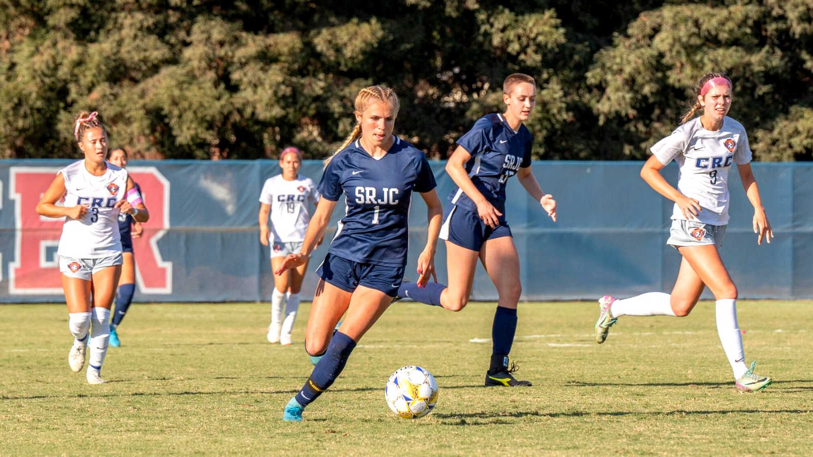 SRJC athletes competing intensely during a basketball game.