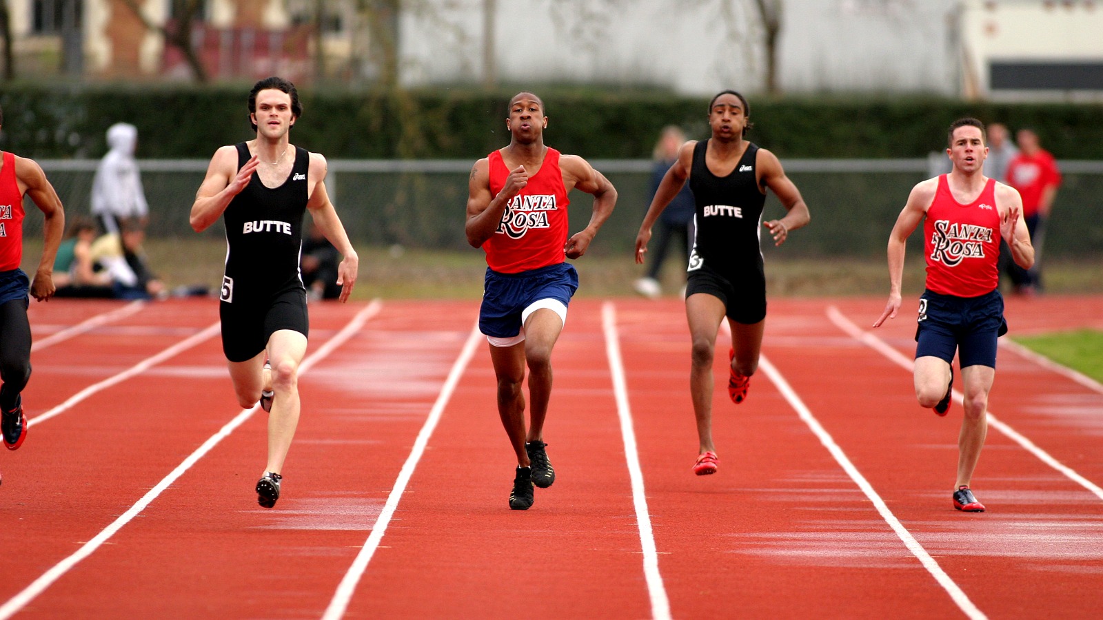 Track athletes sprinting during a race at SRJC.