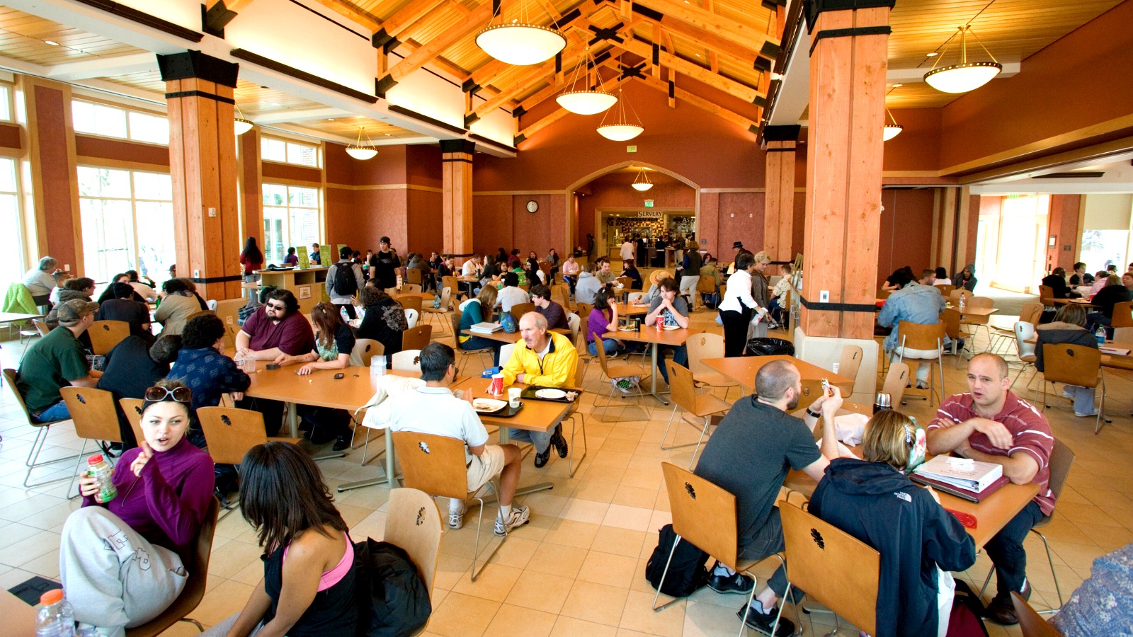 Students eating and socializing inside SRJC’s bright, spacious dining hall.